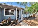 Inviting front entry with decorative door and well-maintained landscaping at 750 Azalea Dr, Bartow, FL 33830