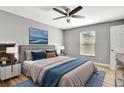 Cozy bedroom featuring a plush bed, stylish decor, and a bright window at 781 Little Pine Dr, South Daytona, FL 32119