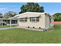 Charming home exterior featuring a manicured lawn, and classic design at 1610 Reynolds Rd # 5, Lakeland, FL 33801