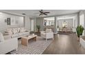 Bright living room with modern furnishings and open floor plan; perfect for entertaining and comfortable living at 358 Canna Dr, Davenport, FL 33897