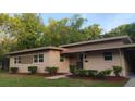 Charming single-story home featuring a well-maintained lawn and neutral exterior paint scheme at 2818 Dellwood Dr, Orlando, FL 32806