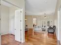 Bright and open living room with hardwood floors, neutral paint, and French doors to the patio at 13708 Old Dock Rd, Orlando, FL 32828