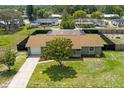 Aerial view of a charming single-story home with a fenced backyard and screened pool area at 4727 Wales St, Lake Wales, FL 33859