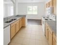 Clean kitchen featuring tile floor, modern appliances, and lots of cabinet space at 6354 Sedgeford Dr, Lakeland, FL 33811