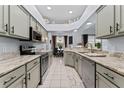 Modern kitchen with granite countertops, stainless steel appliances, and ample cabinet space at 6442 Bendelow Dr, Lakeland, FL 33810