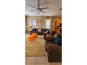 Comfortable living room features a plush sofa, decorative pillows, and stylish accents at 153 Tigerlily Ct, Davenport, FL 33837