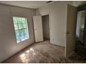 Empty bedroom featuring bright window light and closet space at 6736 Cr 772, Webster, FL 33597