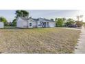 Quaint single-Gathering house with a spacious lawn, driveway, and attached garage, ideal for suburban living at 2769 Corrigan Dr, Deltona, FL 32738