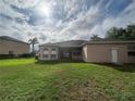 Expansive backyard featuring a lush green lawn, perfect for outdoor activities at 2163 Wintermere Pointe Dr, Winter Garden, FL 34787