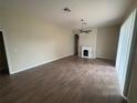 Inviting living room with a decorative fireplace and ample natural light at 2163 Wintermere Pointe Dr, Winter Garden, FL 34787