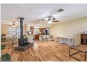 Open-concept living area with hardwood floors and a cozy fireplace at 3646 Palm Rd, Lakeland, FL 33810