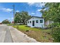 Charming one-story home featuring a well-maintained lawn, simple landscaping, and a cute mailbox at 528 S Seminole Ave, Fort Meade, FL 33841