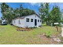 Charming one-story home featuring a well-maintained lawn, simple landscaping, and a cute mailbox at 528 S Seminole Ave, Fort Meade, FL 33841