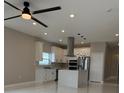 Modern kitchen with stainless steel appliances, white cabinets, a center island and recessed lighting at 209 W 6Th St, Lakeland, FL 33805