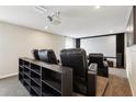 Comfortable home theater with plush seating, projector, and screen, perfect for entertaining or Gathering movie nights at 392 Summer Squall Rd, Davenport, FL 33837