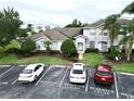 A townhouse with manicured landscaping and reserved parking spaces at 13140 Summerton Dr, Orlando, FL 32824