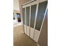 Hallway closet with ornate folding doors at 5532 Stull Ave, Orlando, FL 32810