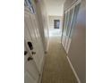 Bright hallway with closet and natural light, showcasing the home's layout at 5532 Stull Ave, Orlando, FL 32810