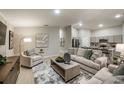 Open-concept living room that showcases modern decor and seamless flow to the kitchen at 1038 Foreshore Ln, Haines City, FL 33844