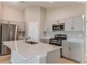 Modern kitchen featuring stainless steel appliances and a quartz countertop island at 4015 Gardenia Ave, Lake Hamilton, FL 33851