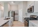 Well-equipped kitchen with stainless steel appliances, quartz countertops, and ample cabinet space at 4015 Gardenia Ave, Lake Hamilton, FL 33851