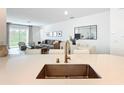 Open-concept living area with modern decor and plenty of natural light at 800 Reggie Rd, Winter Haven, FL 33884