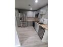 Well-appointed kitchen featuring stainless steel appliances, light grey cabinets, and modern countertops at 312 Dorothy Ave, Daytona Beach, FL 32117