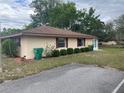 Home with well-maintained landscaping, matching trim, and a tidy lawn at 42 Villa Villar Ct # 420, Deland, FL 32724
