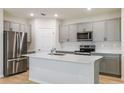 Modern kitchen with stainless steel appliances and a spacious center island at 3782 King Hill Dr, Haines City, FL 33844