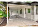 Covered carport featuring two doors, providing ample space for parking and storage at 211 W Crescent Dr, Lakeland, FL 33805