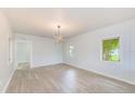 Bright and airy living room with wood floors, offering a stylish and comfortable living space at 211 W Crescent Dr, Lakeland, FL 33805
