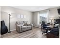Office with a cozy couch, desk, and large window providing natural light at 3839 White Ibis Rd, Lakeland, FL 33811