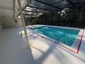 Inviting screened-in pool with ample deck space for entertaining and enjoying the outdoors at 205 Hickory Dr, Longwood, FL 32779