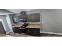 Well-appointed kitchen featuring stainless steel appliances, elegant countertops, and ample cabinet space at 1318 Herschell St, Lakeland, FL 33815