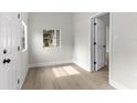Bright bedroom with fresh paint, new floors, and closet creating a serene atmosphere at 630 Pear St, Lakeland, FL 33815