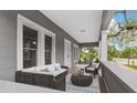 Cozy front porch with stylish seating, creating an inviting outdoor living space at 630 Pear St, Lakeland, FL 33815