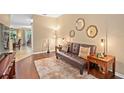 Inviting living room with a comfortable sofa, stylish decor, and warm lighting, perfect for relaxation at 2417 Passamonte Dr # 1E, Winter Park, FL 32792