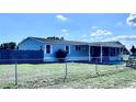 This cozy home features a screened lanai, covered carport, and fenced yard at 4300 Meadow Ridge Ave, Mulberry, FL 33860