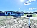 Cozy home with a well-maintained lawn, fenced yard, and a numbered mailbox at 4300 Meadow Ridge Ave, Mulberry, FL 33860