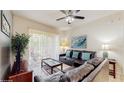 Relaxing living area with balcony access and comfortable seating at 7654 Comrow St # 202, Kissimmee, FL 34747