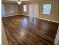 Spacious living room with hardwood floors, plenty of natural light, and ceiling fan at 2414 Willow Oak Dr, Edgewater, FL 32141