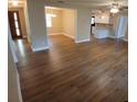 Open-concept living area with modern flooring and a view of the kitchen at 2414 Willow Oak Dr, Edgewater, FL 32141