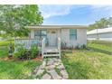Charming single-story home with a cozy front porch and a well-maintained yard at 652 N Jackson St, Eagle Lake, FL 33839