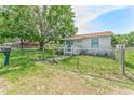 Charming single-story home with a cozy front porch and a well-maintained yard at 652 N Jackson St, Eagle Lake, FL 33839