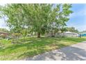 Spacious fenced yard with mature trees, offering privacy and shade at 652 N Jackson St, Eagle Lake, FL 33839