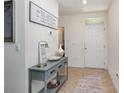 Welcoming entryway features a stylish console table and neutral decor at 3333 Costello Cir, Winter Haven, FL 33884