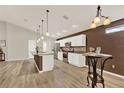 Bright kitchen with granite countertops, stainless steel appliances, and sleek white cabinets at 6376 Sw 117Th Street Rd, Ocala, FL 34476