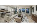Spacious living room with a modern color palette, lots of light, and wood flooring at 1050 Foreshore Ln, Haines City, FL 33844