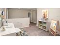 Cozy loft space with desk, shelving, and artwork, perfect for a playroom or study area at 1617 Sage Ave, Haines City, FL 33844