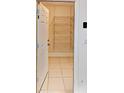 Walk-in pantry with multiple shelves for storage and tile floor at 6255 Christina Ct, Orlando, FL 32810